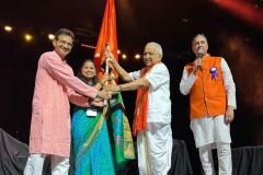 SMM 2024 President Ashwini receiving BMM 2026 Host Flag
